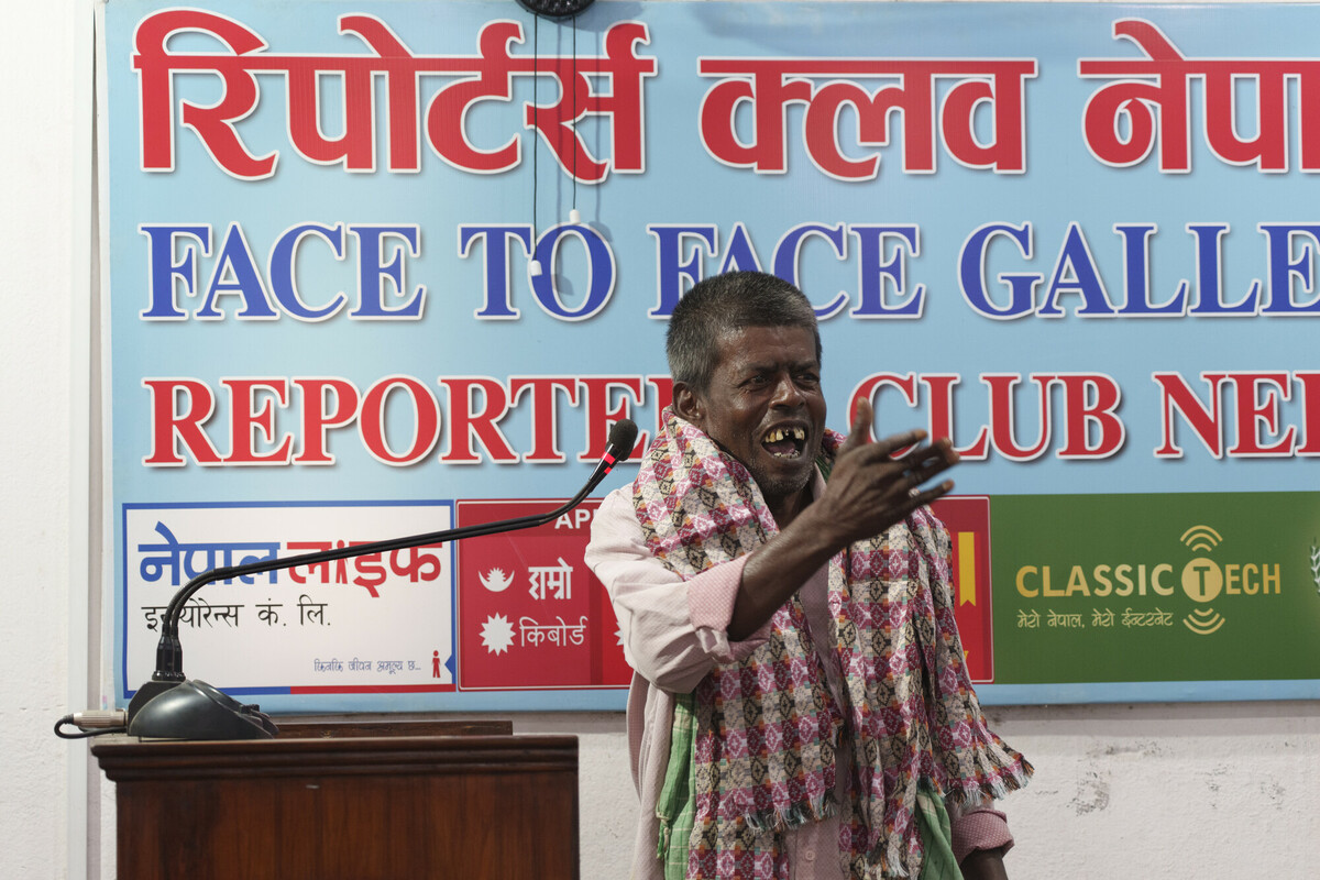 person speaking at stand