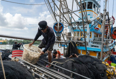 Fishing industry in Samut Sakhon, Thailand. Thailand is a top 5 global seafood producer, with exports reaping over $7 billion. But the profitable industry supplying consumers around the world with cheap seafood comes at a high cost to both the environment and to workers. The overwhelming majority of workers in Thailands fishing and seafood processing industries are migrants from Myanmar, Laos and Cambodia. Labour brokers recruit from vulnerable communities, promising favourable employment in the construction, manufacturing, or agriculture industries. Migrants often incur debt from their recruitment, fees and costs associated with transportation and securing employment in Thailand. These debts are paid off through deductions from workers earnings with employers and brokers frequently using debt manipulation to inflate the amounts and force people into bonded labour. This and the other images in this collection are showing the context in which the Freedom Fund Thailand hotspot operates. They show the location as well as the boats on which migrant workers work. They also show facilities for processing seafood and the markets in which seafood is traded. We do not have names or stories of any of the individuals shown in this collection because that was not the purpose of this commission. Jittrapon Kaicome / The Freedom Fund