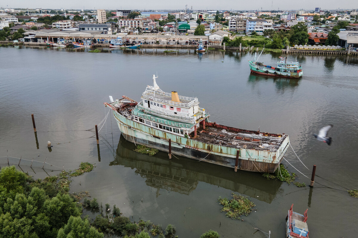 Fishing industry in Samut Sakhon, Thailand. Thailand is a top 5 global seafood producer, with exports reaping over $7 billion. But the profitable industry supplying consumers around the world with cheap seafood comes at a high cost to both the environment and to workers. The overwhelming majority of workers in Thailands fishing and seafood processing industries are migrants from Myanmar, Laos and Cambodia. Labour brokers recruit from vulnerable communities, promising favourable employment in the construction, manufacturing, or agriculture industries. Migrants often incur debt from their recruitment, fees and costs associated with transportation and securing employment in Thailand. These debts are paid off through deductions from workers earnings with employers and brokers frequently using debt manipulation to inflate the amounts and force people into bonded labour. This and the other images in this collection are showing the context in which the Freedom Fund Thailand hotspot operates. They show the location as well as the boats on which migrant workers work. They also show facilities for processing seafood and the markets in which seafood is traded. We do not have names or stories of any of the individuals shown in this collection because that was not the purpose of this commission. Jittrapon Kaicome / The Freedom Fund